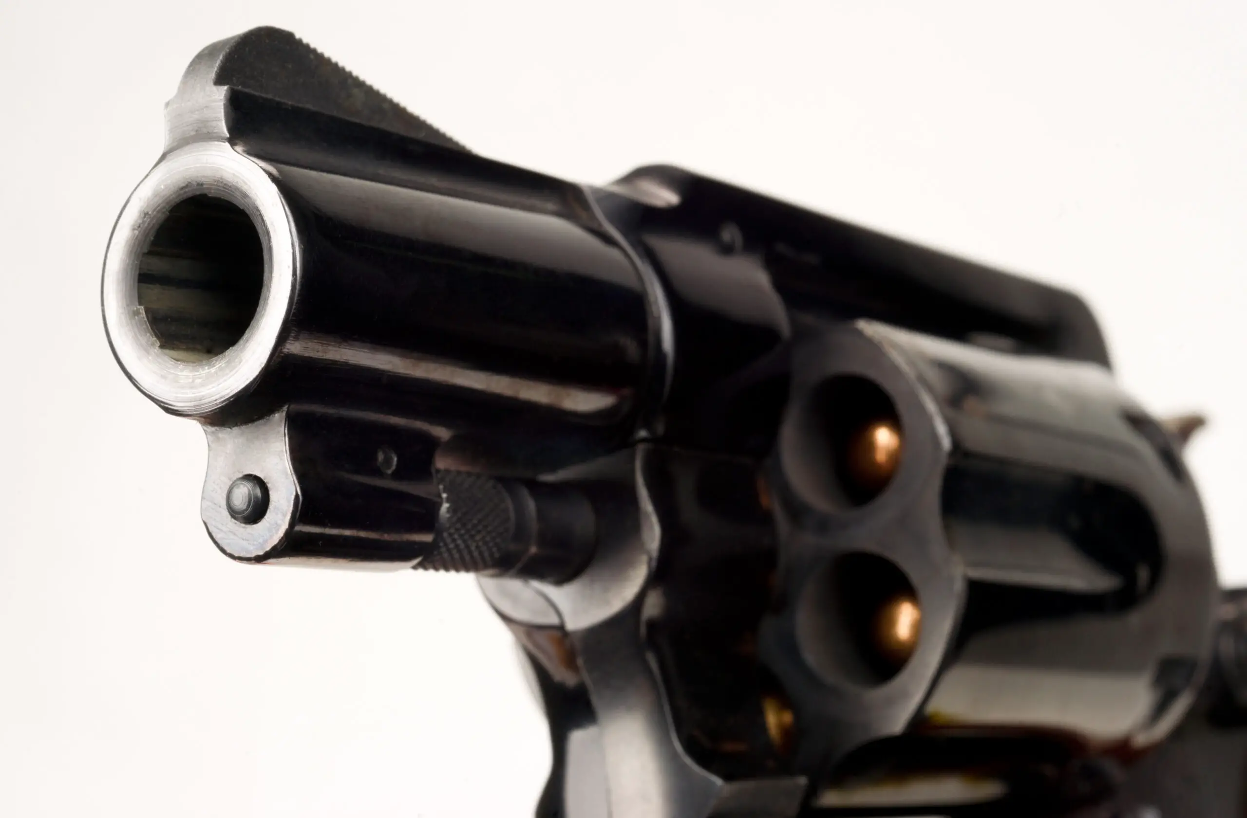 38 Caliber Revolver Pistol Loaded Cylinder Gun Barrel Close Up Pointed on White