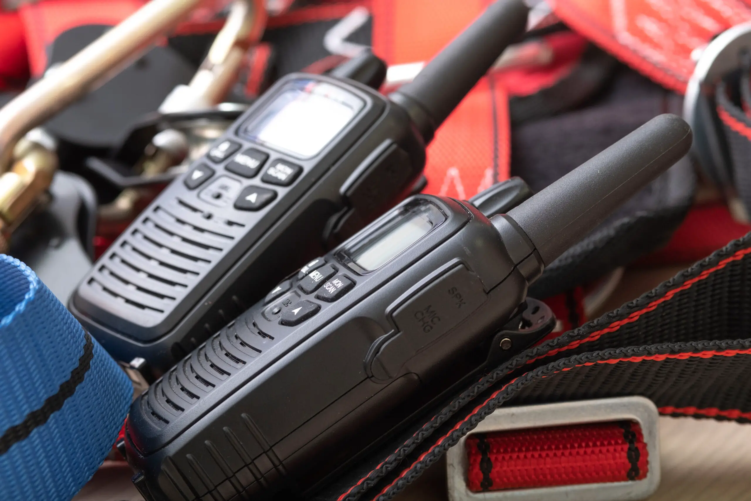 two radios and gear for climbers, rescue workers, red ropes and connection