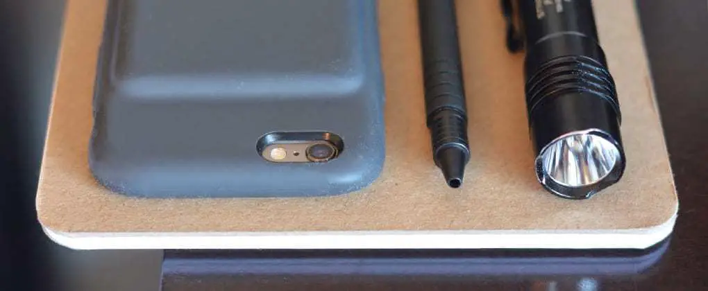 notebook, pen, and cell phone